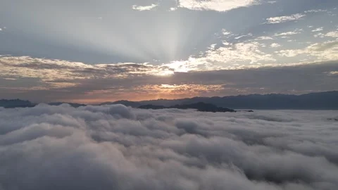 Aerial View of Sun Rays Above Sea of Clouds and Mountains, Luang Prabang Stock-Footage 347423056