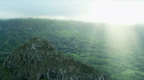 Aerial view of sun rays on volcanic cliffs, Hawaii Stock Footage 21766648
