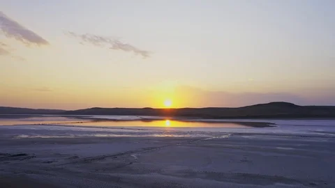 Aerial view sun reflection in lake water during sunset Stock Footage 118740848