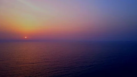 Aerial view Sun Rising Over the Calm Sea Stock Footage 104544137