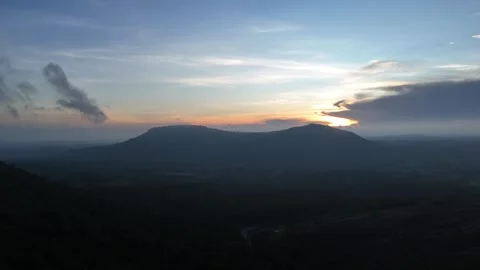 Aerial view of the sun setting behind mountains DLOG Footage Stock Footage 302265334
