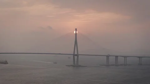 Aerial View of Sun Setting Behind Incheon Bridge Pylon Stock Footage 342238307