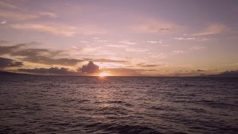 Aerial View Of Sun Setting Over Gentle Rolling Waves Video stock 83793867