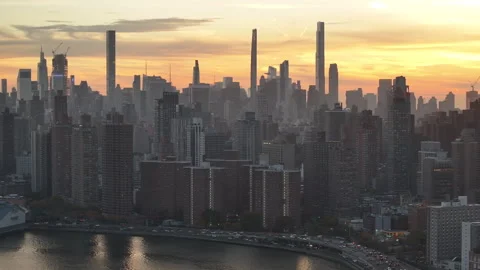 Aerial view of the sun setting over Manhattan Stock Footage 254217106