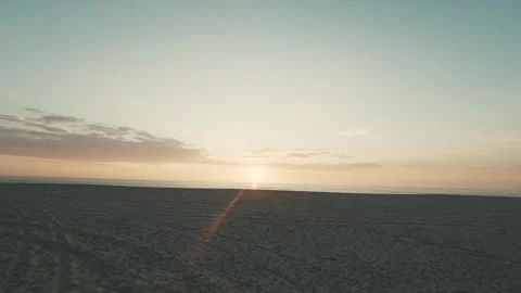 Aerial view of sun setting over vast ocean Stock Footage 340227734