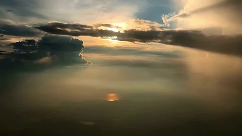 Aerial View of Sun Setting Through Cloudscape Stock Footage 310419491