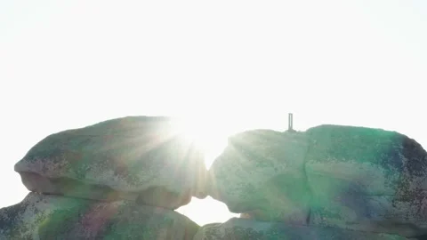 Aerial view of the sun through the rock Stock Footage 146680558