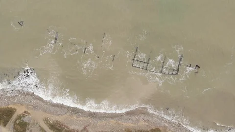 Aerial view of the sunken cargo vessel during surf. Stock Footage 101306089