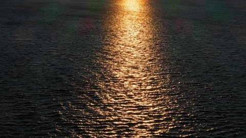 Aerial View of Sunlight Reflected from Sea Surface at Sunset Stock Footage 116412349