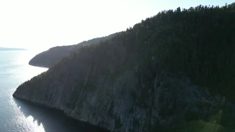 Aerial View of a Sunlit Cliff Above the Saguenay Fjord Vídeos de archivo 338328233