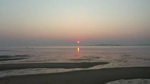 Aerial View of a Sunlit Tidal Mudflat at Sunrise Stock Footage 345235036