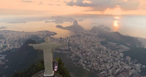 Aerial view of sunrise above Sugarloaf Mountain and Botafogo Bay, Rio de Janeiro Stock Footage