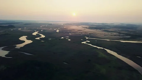 Aerial view of sunrise over river, Stock Footage 119032010