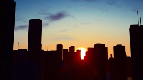 Aerial view of sunrise silhouette of a coastal city Stock-Footage 321785953