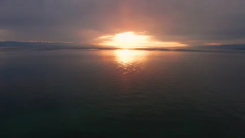 Aerial view of the sunset on the alpine Issyk-Kul lake, Kyrgyzstan. Stock Footage 163829733
