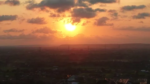Aerial view of sunset and silhouette of high voltage power lines and countryside 스톡 동영상 321663142