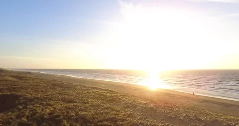 Aerial View Sunset on the Beach, Calm Waves Stock Footage