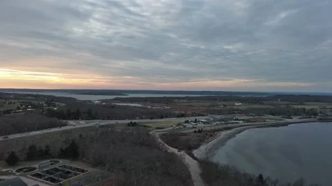 Aerial view of sunset, beach, jungle and highway in Rhode Island, USA Video stock 232394028