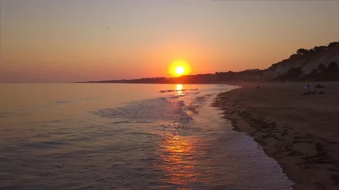Aerial View at Sunset Beach with Waves Stock Footage 130067849