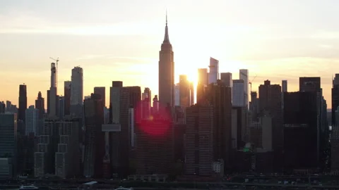 Aerial view of the sunset behind The Empire State Building Stock Footage 308486950