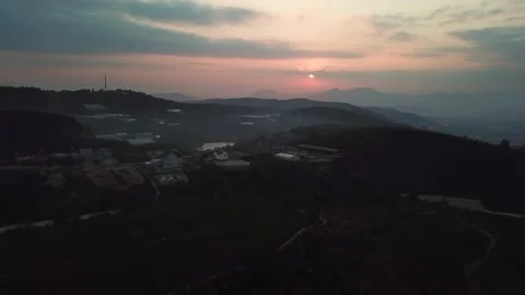 Aerial view of sunset in Cau Dat Tea Hill in Dalat, Lam Dong, Vietnam Stock Footage 130997857