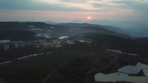Aerial view of sunset in Cau Dat Tea Hill in Dalat, Lam Dong, Vietnam Stock Footage 130998188