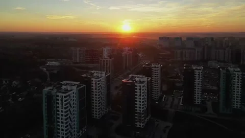 Aerial view of sunset in cityscape. Flight over the cityscape at sunset. Stock Footage 163979421