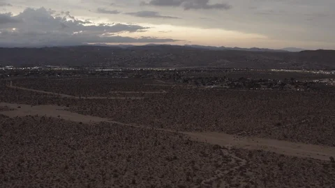 Aerial View of the sunset in the desert flying over trees and shrubs Stock Footage 95939162