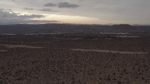 Aerial View of the sunset in the desert flying over trees and shrubs Stock Footage 95939181