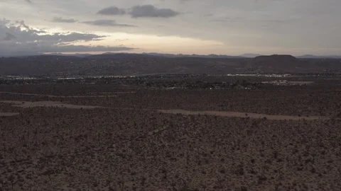 Aerial View of the sunset in the desert flying over trees and shrubs Video stock 95952964
