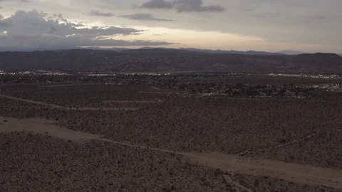 Aerial View of the sunset in the desert flying over trees and shrubs Stock Footage 95954876
