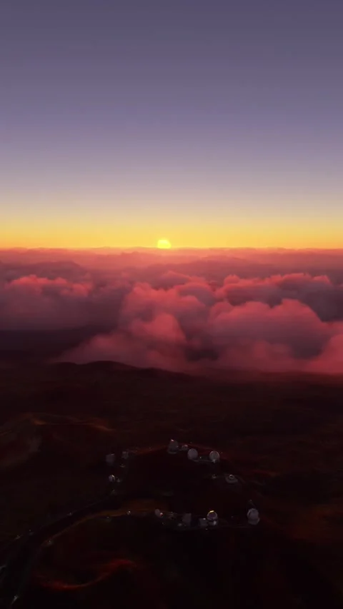 Aerial view at sunset flying over Mauna Kea observatory in Hawaii Stock Footage 283142149
