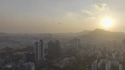 Aerial View of Sunset Glow Over Pyeongchon and Beomgye Cityscape Stock Footage 325173679