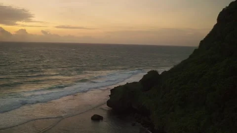 Aerial View Sunset of Ocean Waves Rolling Over Tropical Coastline Video stock 331276610