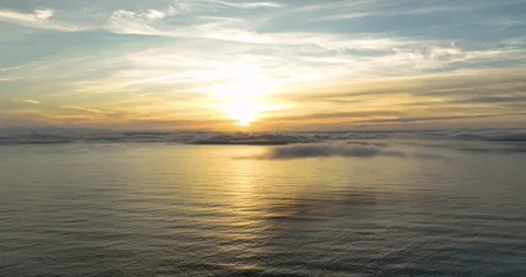 Aerial view of sunset over the Atlantic Ocean and clouds in Ireland Stock Footage 343373036