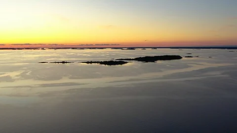 Aerial view of a sunset over a calm sea Stock Footage 124389302