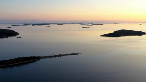 Aerial view of a sunset over a calm sea Video stock 124389892