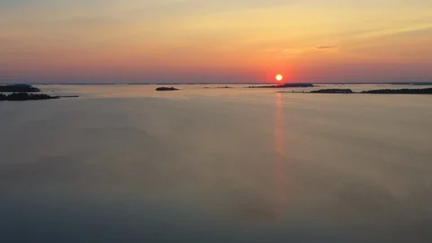 Aerial view of a sunset over a calm sea Stock Footage 124395287