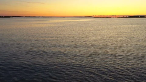 Aerial view of a sunset over a calm sea Stock Footage 124397684