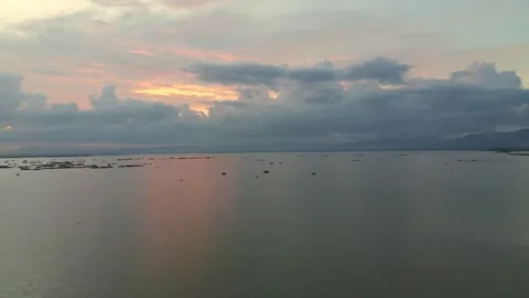 Aerial View of Sunset Over a Calm Lake with Boats Stock Footage 333767998