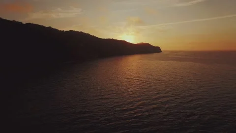 Aerial view of a sunset over the cliff at the sea Stock Footage 253181762