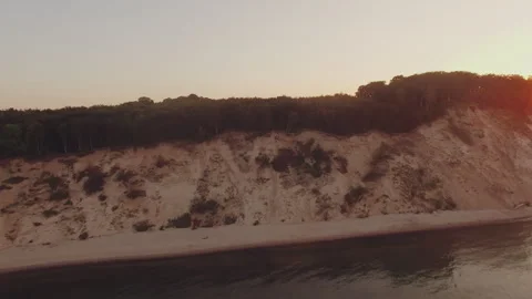 Aerial view of a sunset over the cliff at the sea Stock Footage 253185051