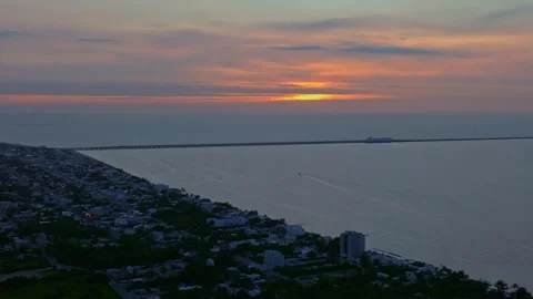 Aerial view of sunset over coastline and pier, Mexico. Stock Footage 284847879