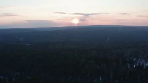 Aerial view of the sunset over the endless forest Stock Footage 150932465