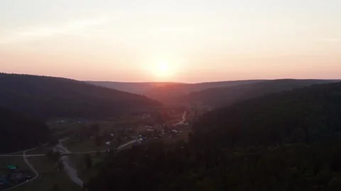 Aerial view of the sunset over the forest Stock Footage 252026752