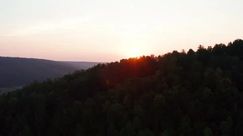 Aerial view of the sunset over the forest Stock Footage 252246378