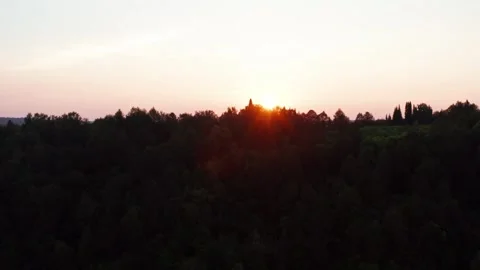 Aerial view of the sunset over the forest Stock Footage 252246579