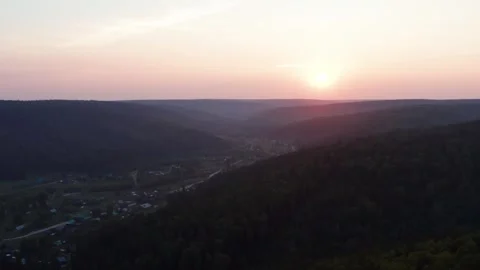 Aerial view of the sunset over the forest Stock Footage 252563179