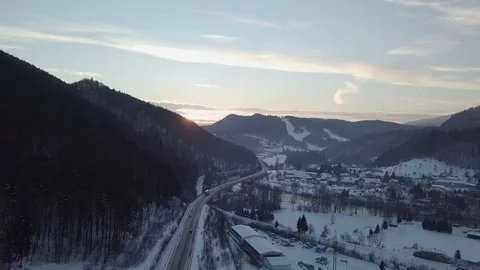 Aerial view of sunset over high way in winter Stock Footage 85015537