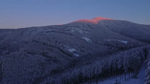 Aerial view of sunset over Lysa hora covered with snow Stock Footage 227181433